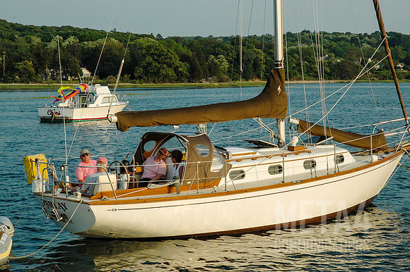 Sailboaters Relaxing at a Mooring