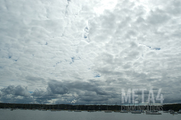 Dark Clouds Cover Sailboats