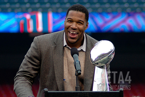 Giants DE Michael Strahan with the Super Bowl XLII Trophy